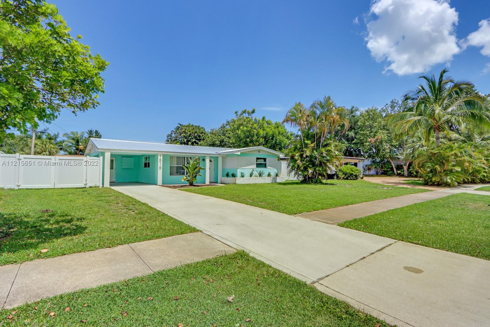 1515 Seabrook Road Jupiter, FL 33469 - Photo 2 of 29 a view of a house with a yard