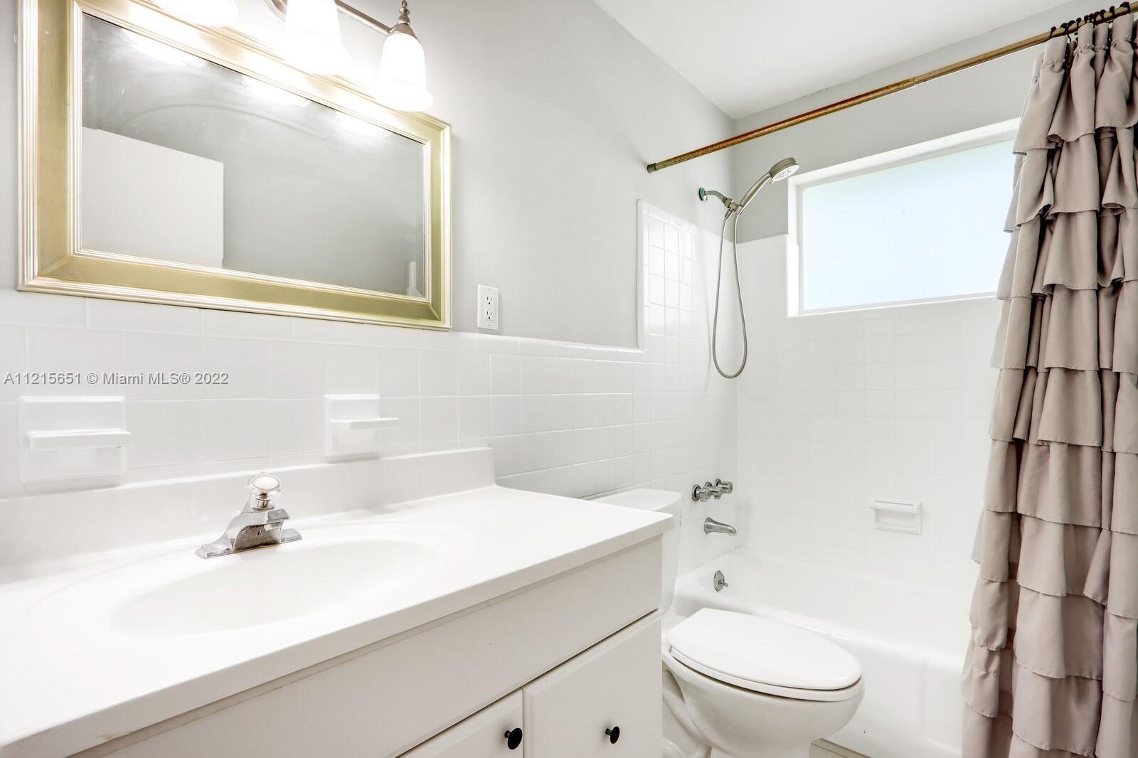 1515 Seabrook Road Jupiter, FL 33469 - Photo 23 of 29 a bathroom with a sink a toilet and shower