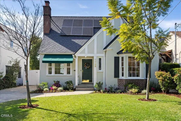 front view of a house with a yard