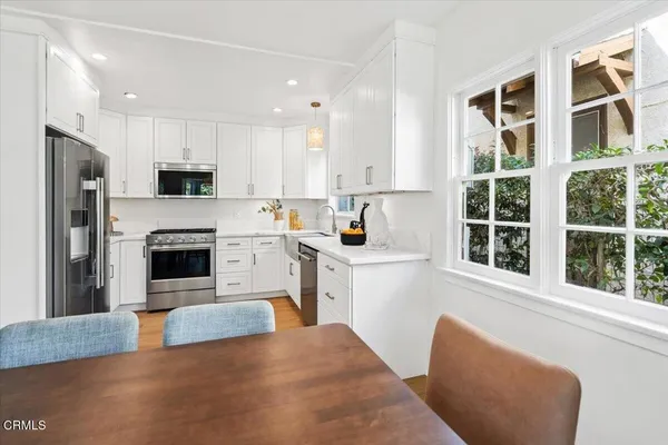 a view of kitchen with furniture and large window