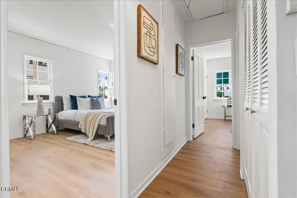 a bedroom with a bed and a couch