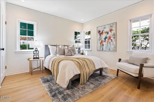 a bedroom with a bed and a couch