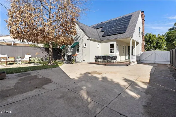 a view of the house with a yard