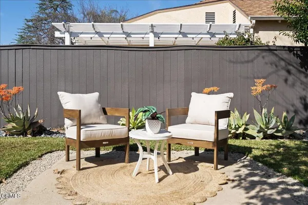 a view of a chairs and table on the terrace