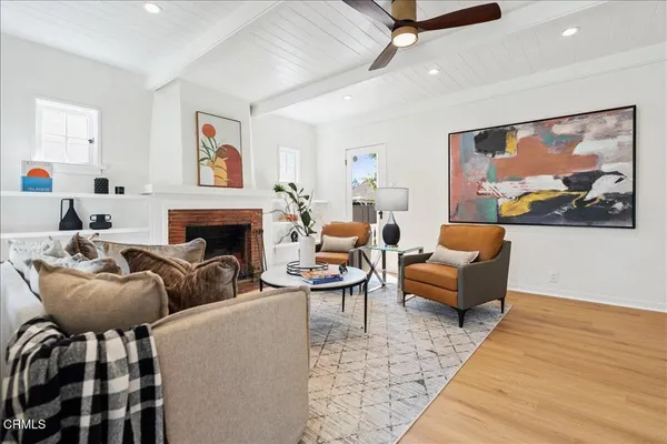 a living room with furniture and a fireplace