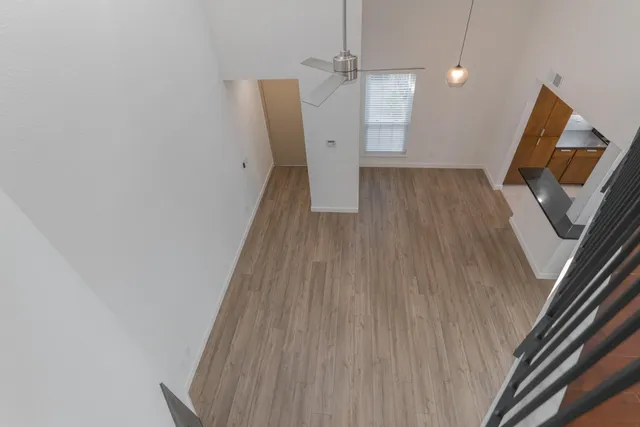 a view of a livingroom with wooden floor