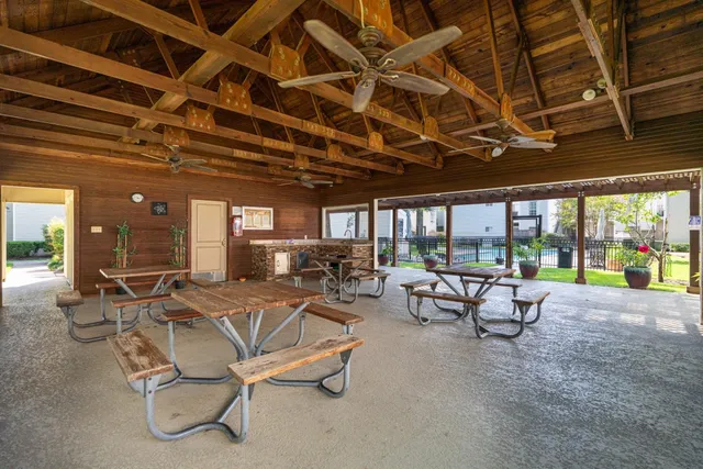 a view of a swimming pool with outdoor seating space