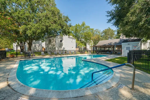 a view of a swimming pool with a patio