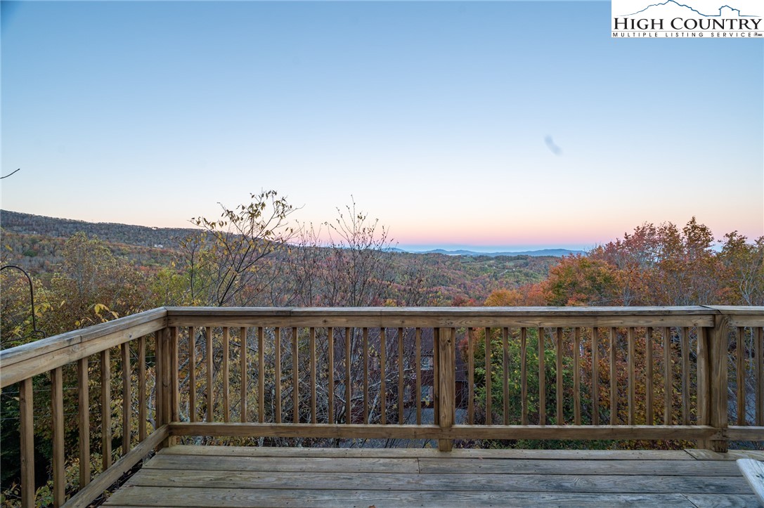 309 Pinnacle Ridge Road Beech Mountain, NC 28604 - Photo 33 of 45 a view of a balcony with wooden fence and floor