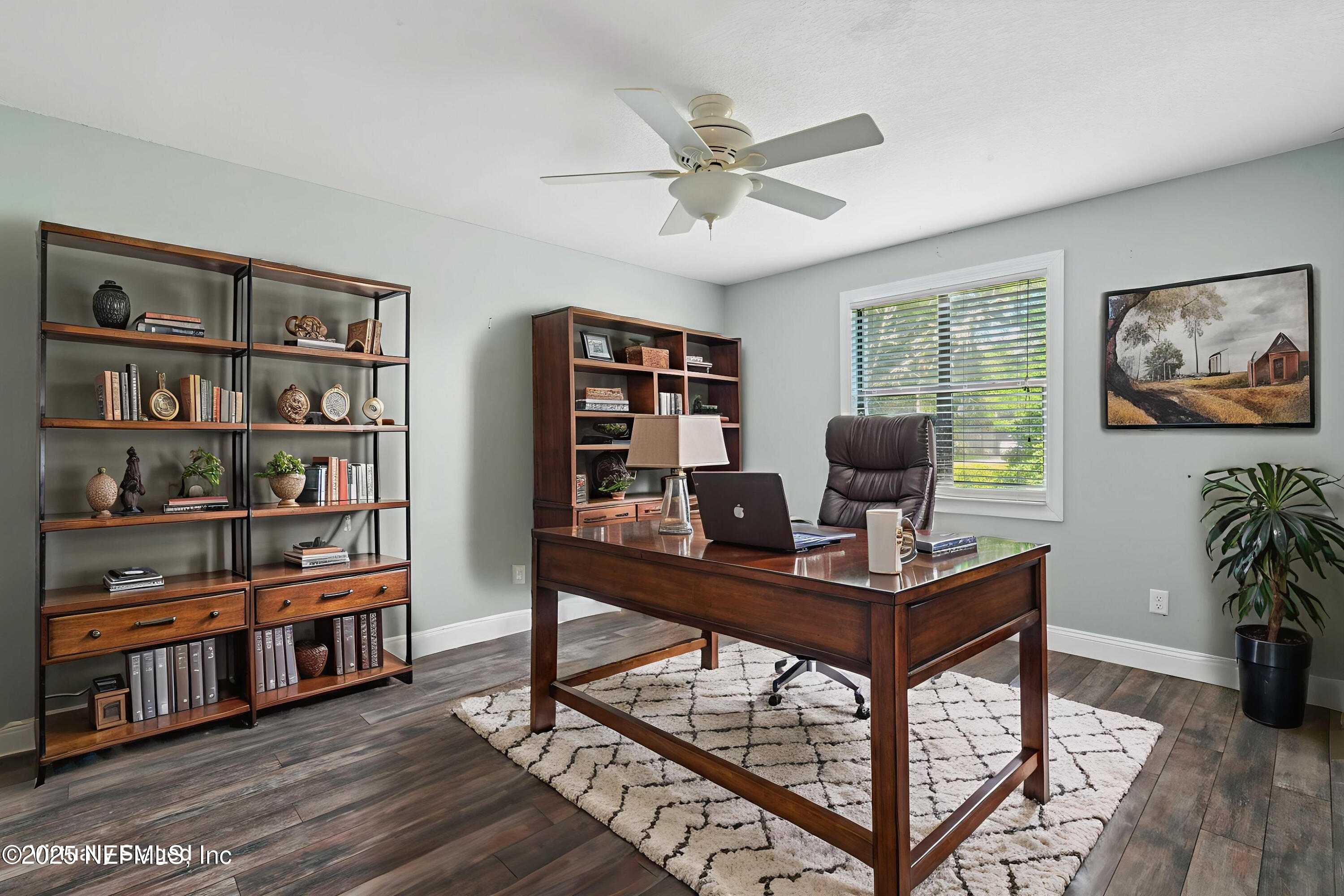2822 Circle Ridge Drive Orange Park, FL 32065 - Photo 15 of 41 a view of a workspace with furniture and a bookshelf