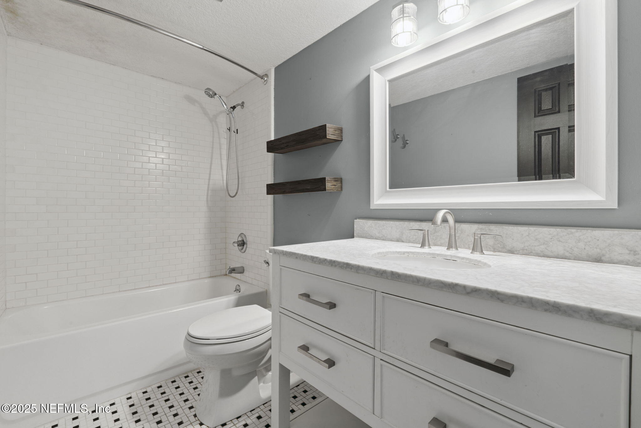 2822 Circle Ridge Drive Orange Park, FL 32065 - Photo 17 of 41 a bathroom with a granite countertop toilet a sink and a bathtub