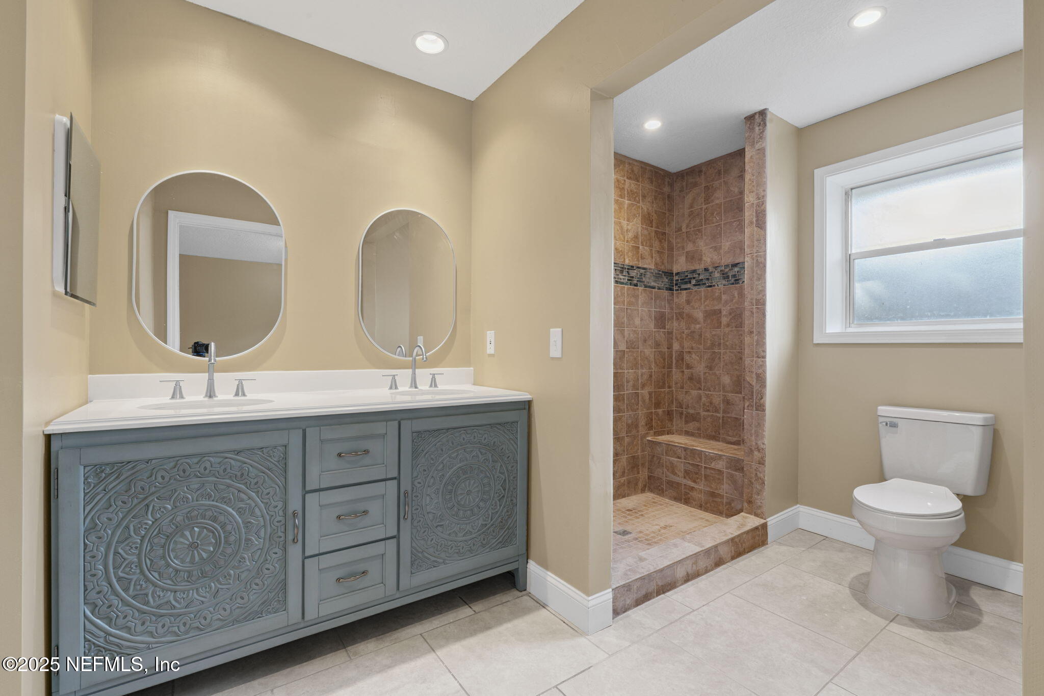 2822 Circle Ridge Drive Orange Park, FL 32065 - Photo 23 of 41 a bathroom with a double vanity sink and a toilet
