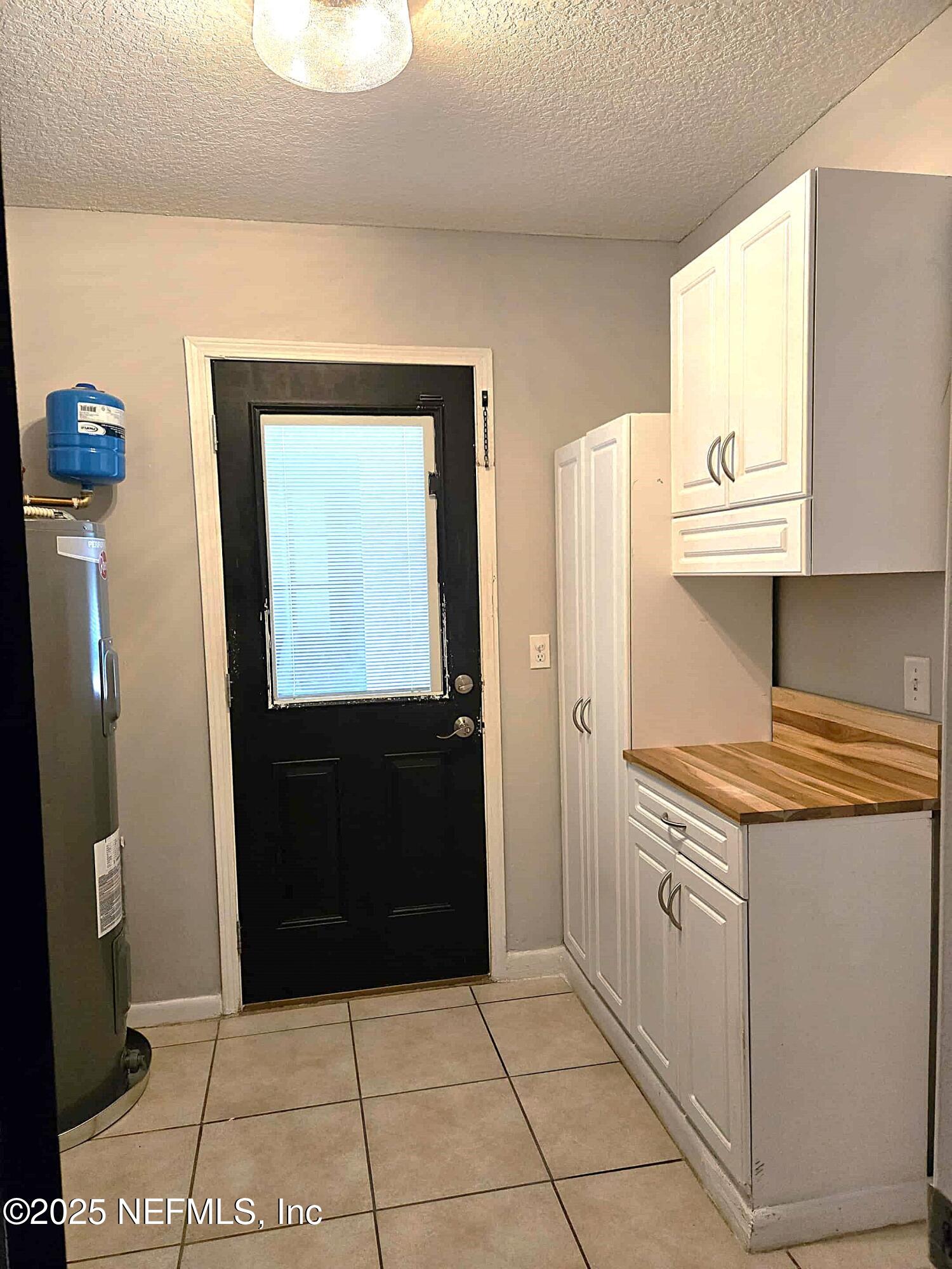 2822 Circle Ridge Drive Orange Park, FL 32065 - Photo 40 of 41 a kitchen with granite countertop a stove top oven and cabinets