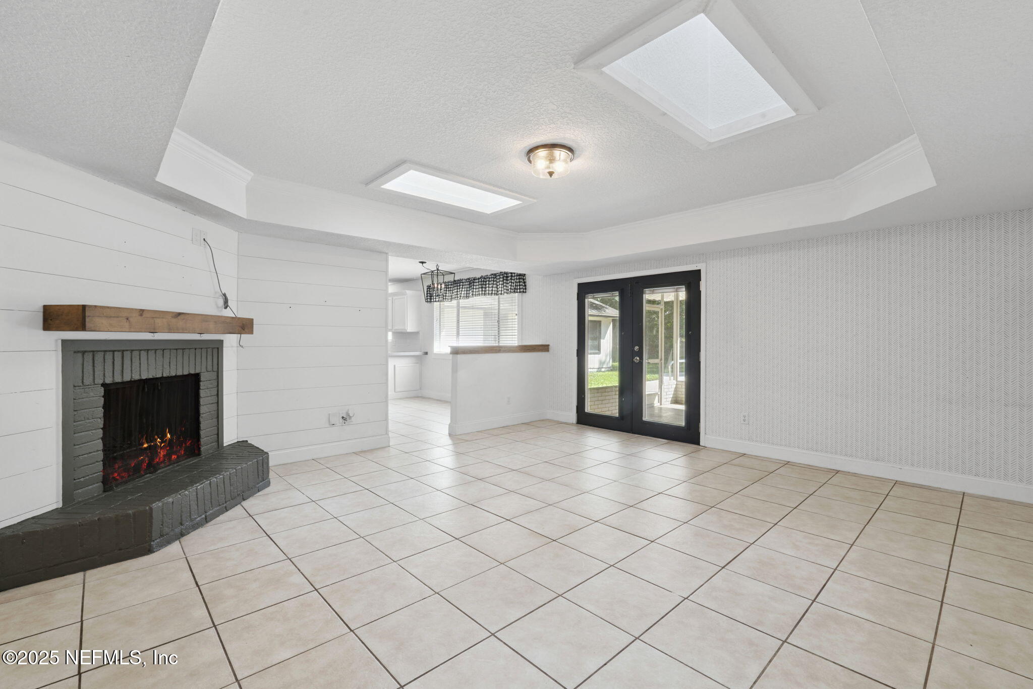 2822 Circle Ridge Drive Orange Park, FL 32065 - Photo 7 of 41 a view of an empty room with window and fireplace