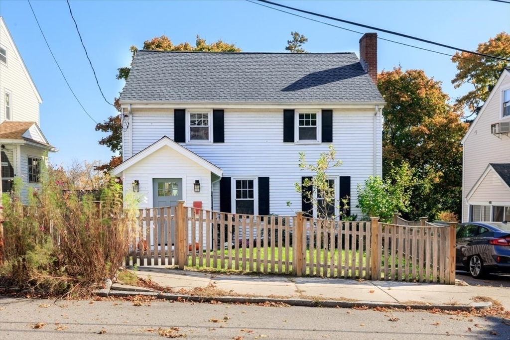 40 Chisholm Road Boston, MA 02131 - Photo 1 of 33 a front view of a house with a garden