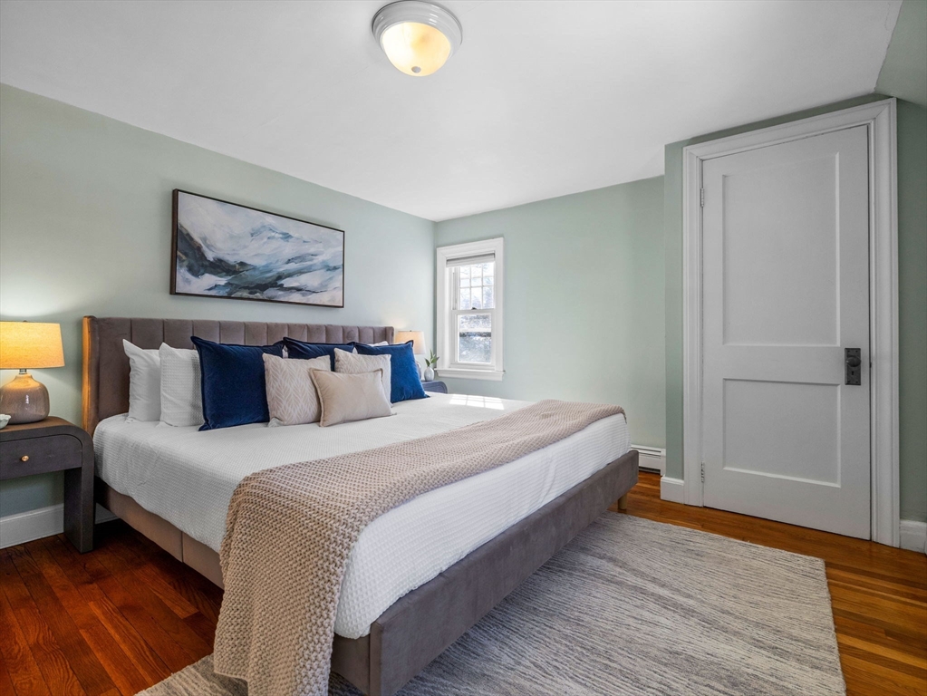 40 Chisholm Road Boston, MA 02131 - Photo 13 of 33 a bedroom with bed and window