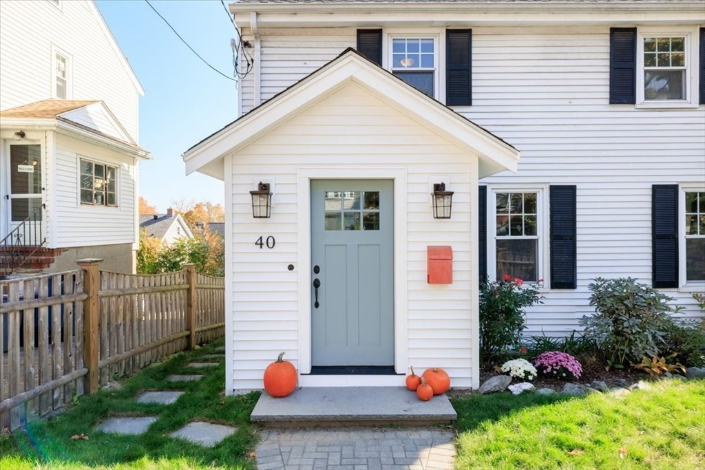 40 Chisholm Road Boston, MA 02131 - Photo 2 of 33 a view of a house with yard and flowers