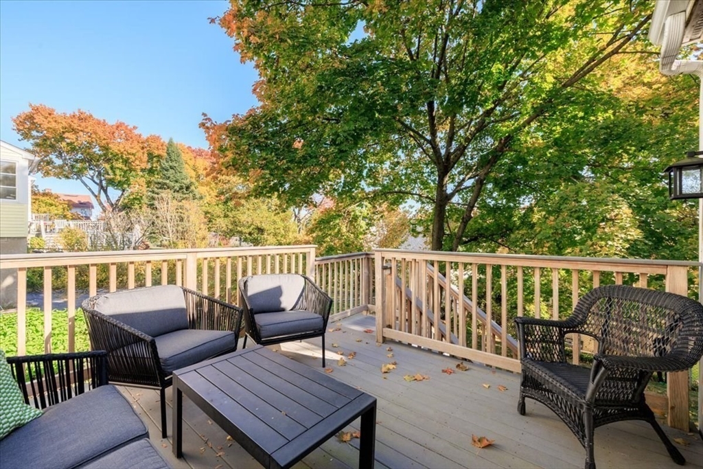 40 Chisholm Road Boston, MA 02131 - Photo 21 of 33 a view of a balcony with wooden floor and outdoor seating