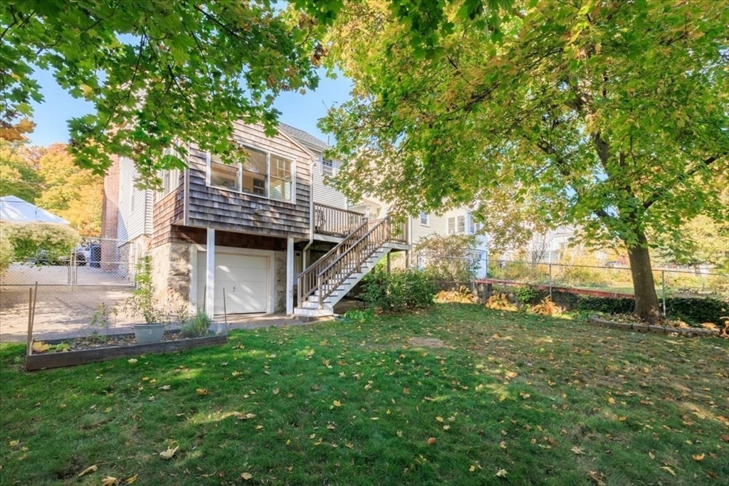 40 Chisholm Road Boston, MA 02131 - Photo 22 of 33 a backyard of a house with table and chairs