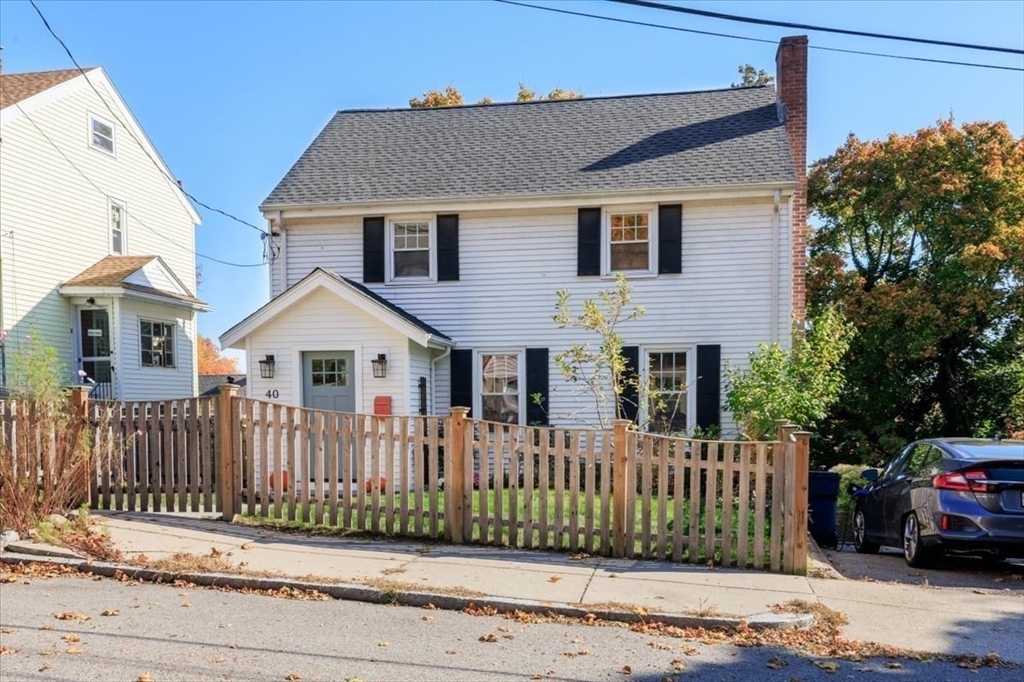 40 Chisholm Road Boston, MA 02131 - Photo 29 of 33 a front view of a house with a garden