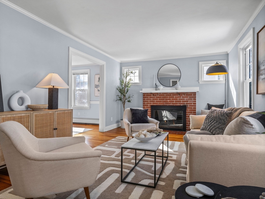 40 Chisholm Road Boston, MA 02131 - Photo 8 of 33 a living room with furniture and a fireplace