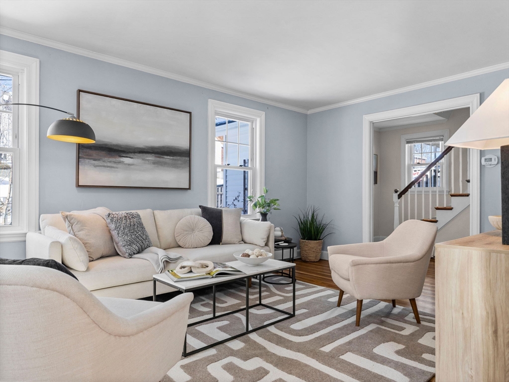 40 Chisholm Road Boston, MA 02131 - Photo 9 of 33 a living room with furniture and a potted plant