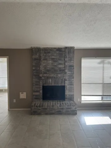 a living room with a fireplace