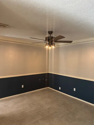 a view of a hallway with a refrigerator