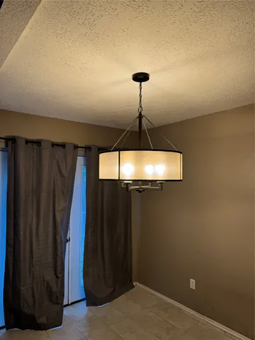 a bathroom with a granite countertop double vanity sink and a mirror