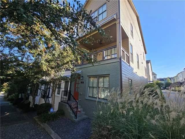 a view of a building with a yard