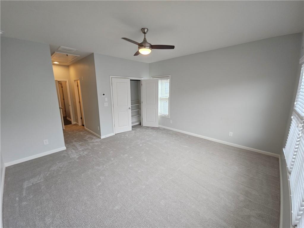 754 Dunlop Way Atlanta, GA 30312 - Photo 12 of 33 an empty room with a ceiling fan and a window