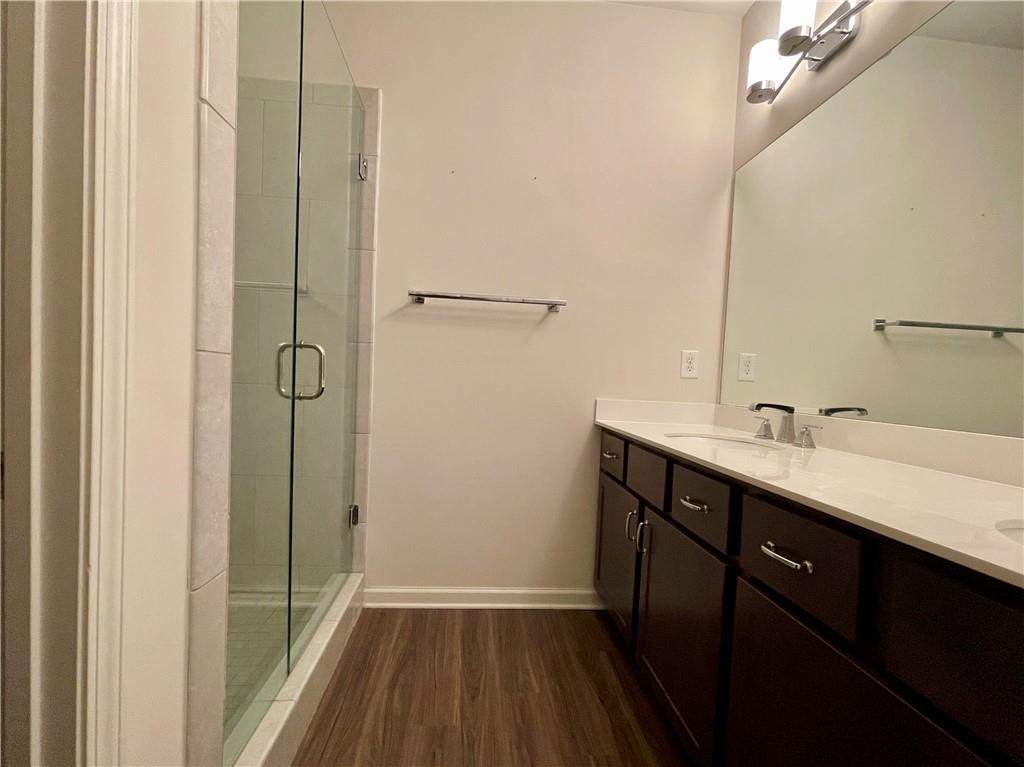 754 Dunlop Way Atlanta, GA 30312 - Photo 14 of 33 a bathroom with a sink a mirror and a shower