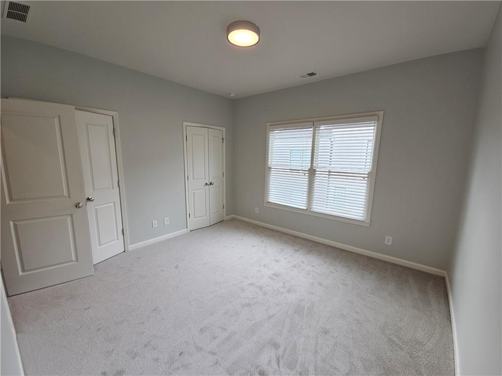 754 Dunlop Way Atlanta, GA 30312 - Photo 18 of 33 an empty room with windows and closet