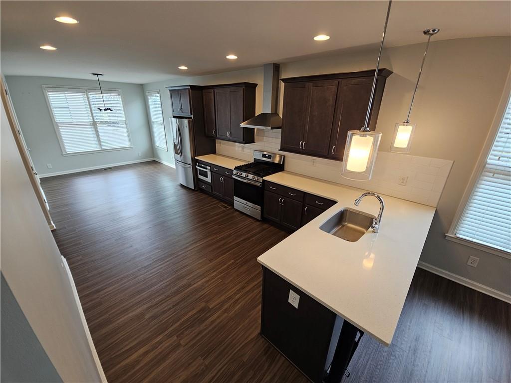 754 Dunlop Way Atlanta, GA 30312 - Photo 28 of 33 a living room with couches and kitchen view with wooden floor