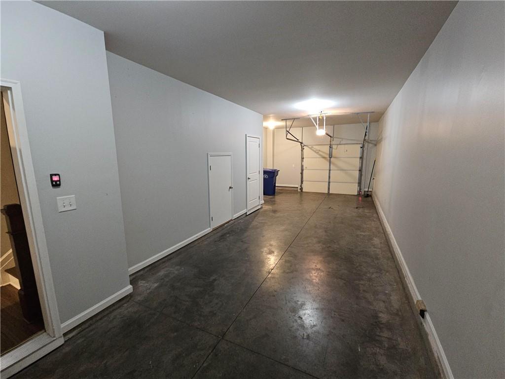 754 Dunlop Way Atlanta, GA 30312 - Photo 30 of 33 an empty room with wooden floor and windows
