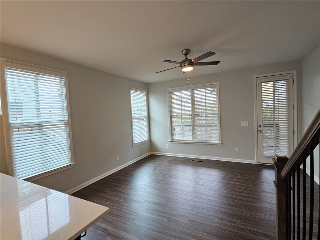 754 Dunlop Way Atlanta, GA 30312 - Photo 3 of 33 a view of an empty room with wooden floor and a window