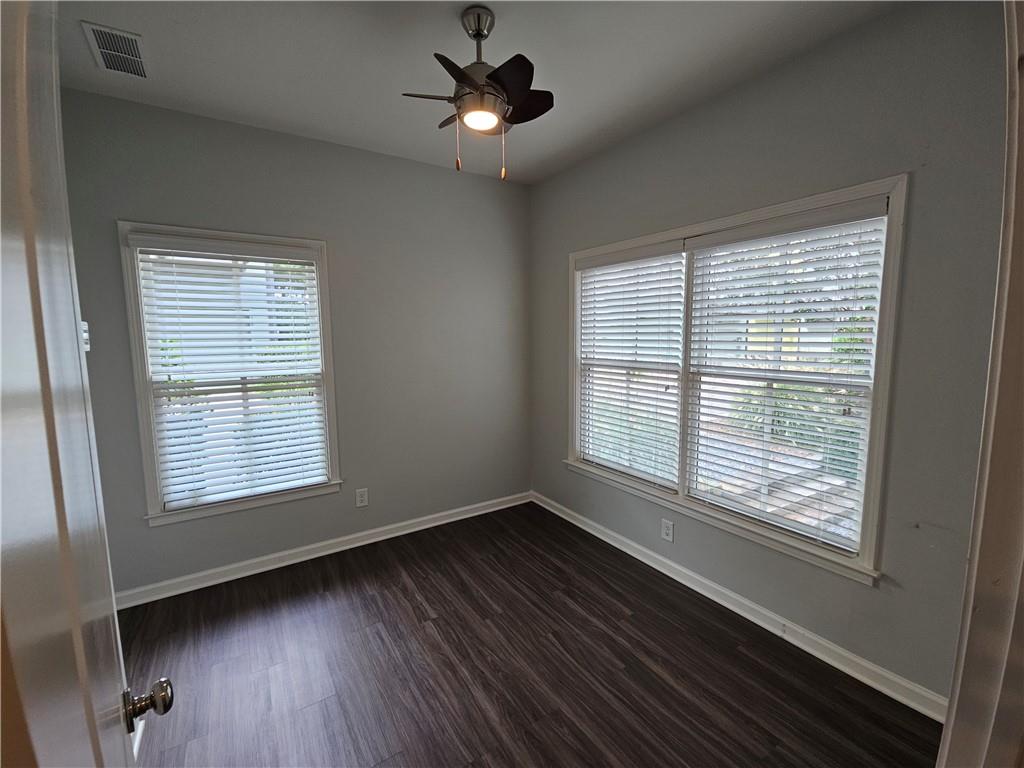 754 Dunlop Way Atlanta, GA 30312 - Photo 9 of 33 a view of an empty room with wooden floor and a window