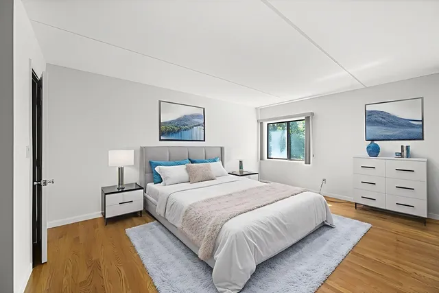 a bedroom with a bed and a dresser