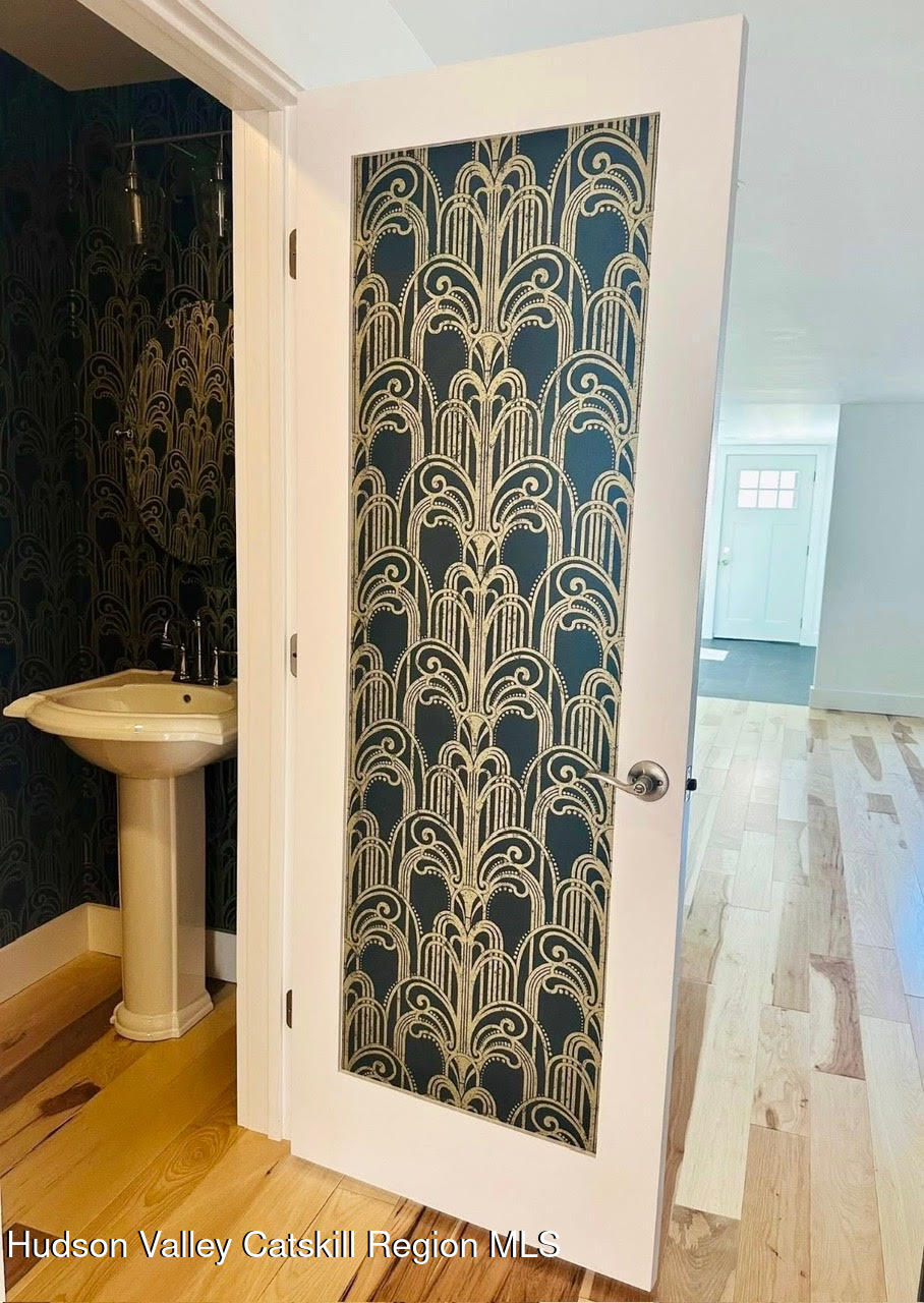 412 Main Street, Unit 3 Catskill, NY 12414 - Photo 12 of 16 a bathroom with a toilet and a shower curtain