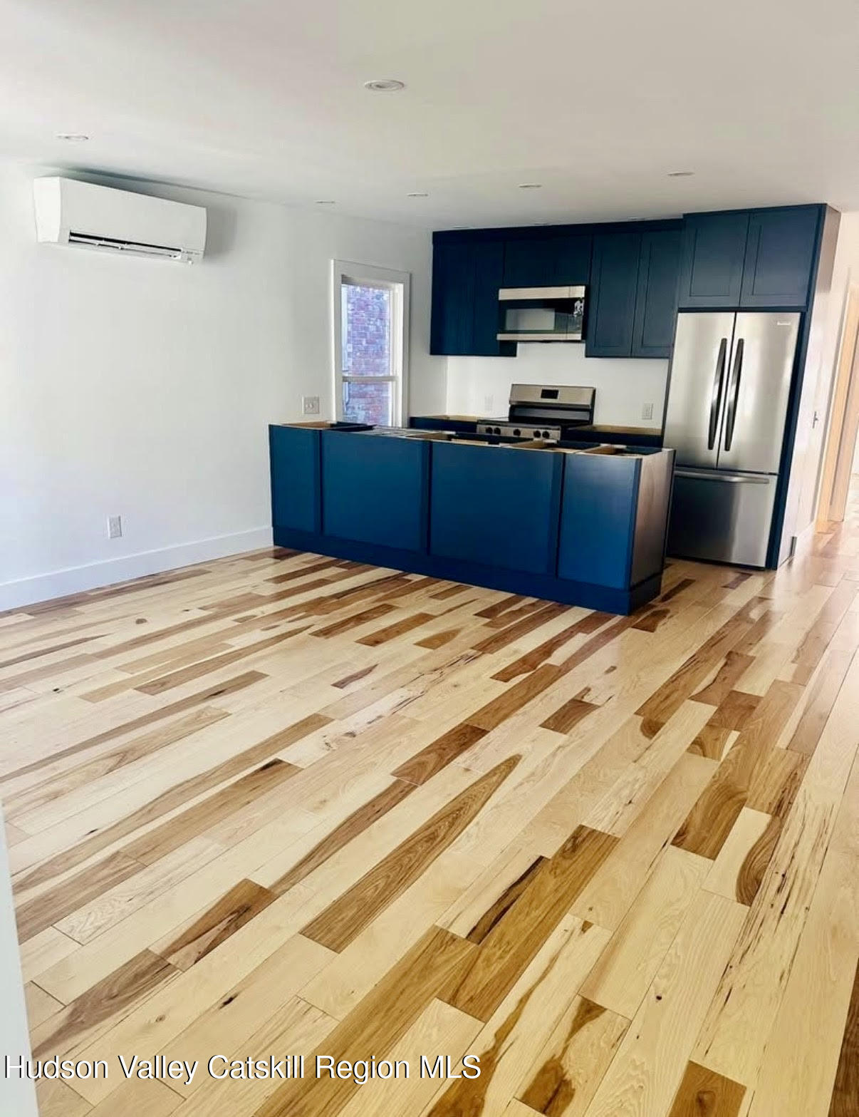 412 Main Street, Unit 3 Catskill, NY 12414 - Photo 5 of 16 a bedroom with a bed and dresser