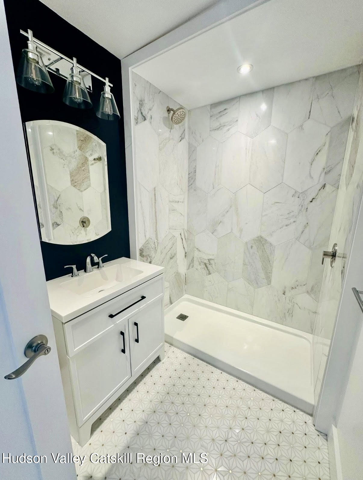 412 Main Street, Unit 3 Catskill, NY 12414 - Photo 10 of 16 a bathroom with a sink a toilet and bathtub