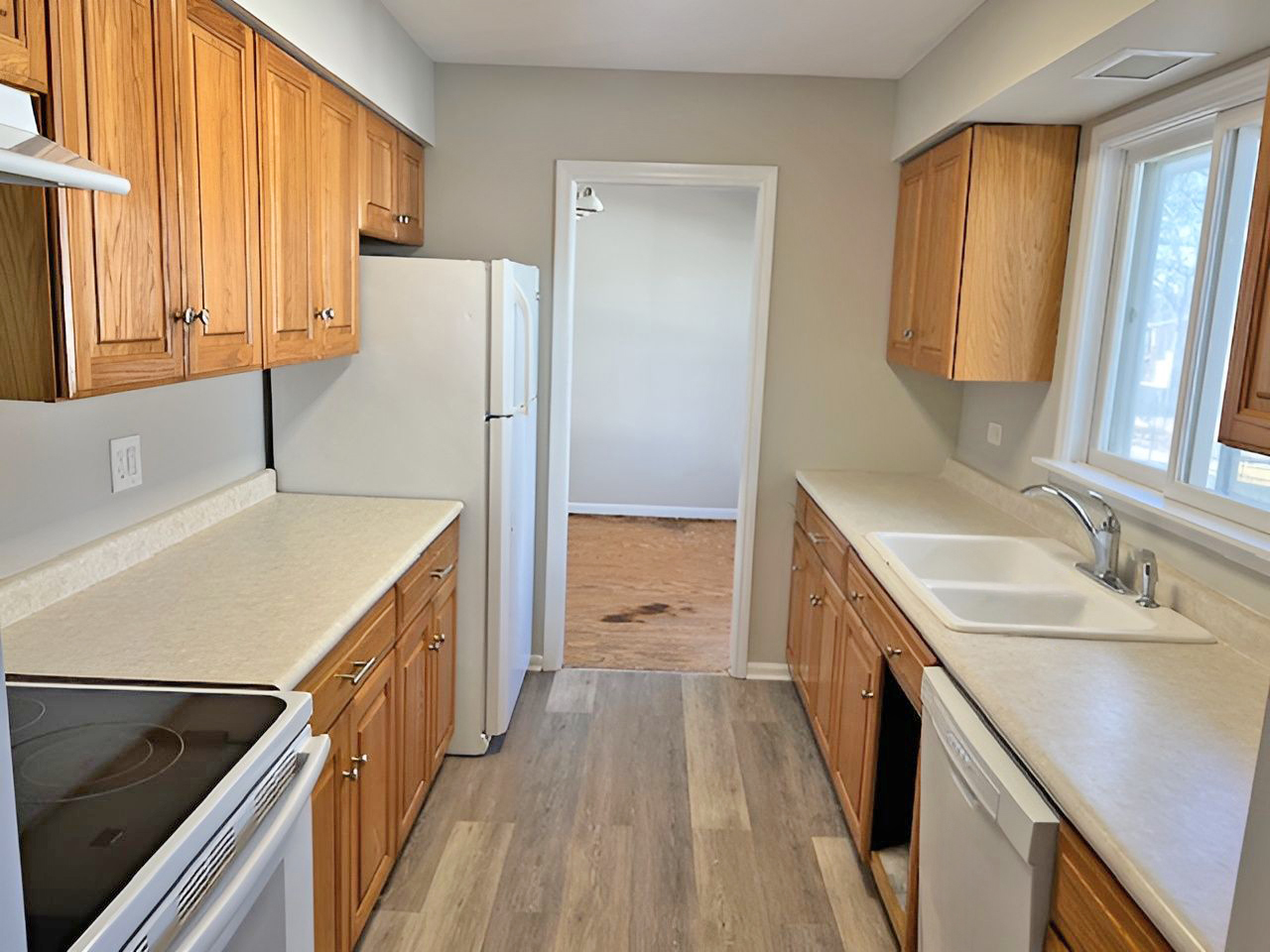 654 Longview Drive Antioch, IL 60002 - Photo 11 of 39 a kitchen with a sink a counter top space stainless steel appliances and a window