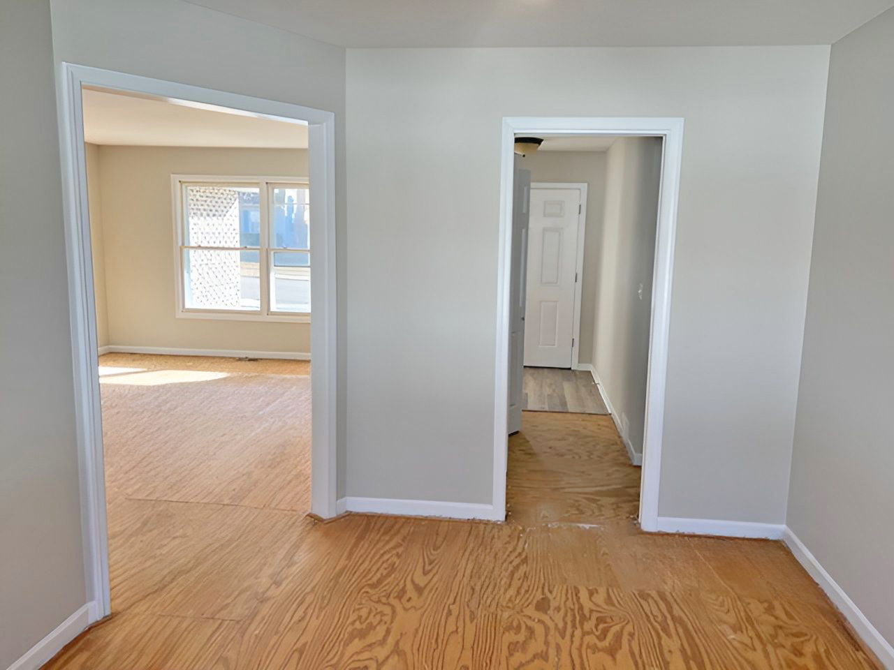 654 Longview Drive Antioch, IL 60002 - Photo 15 of 39 an empty room with wooden floor and windows