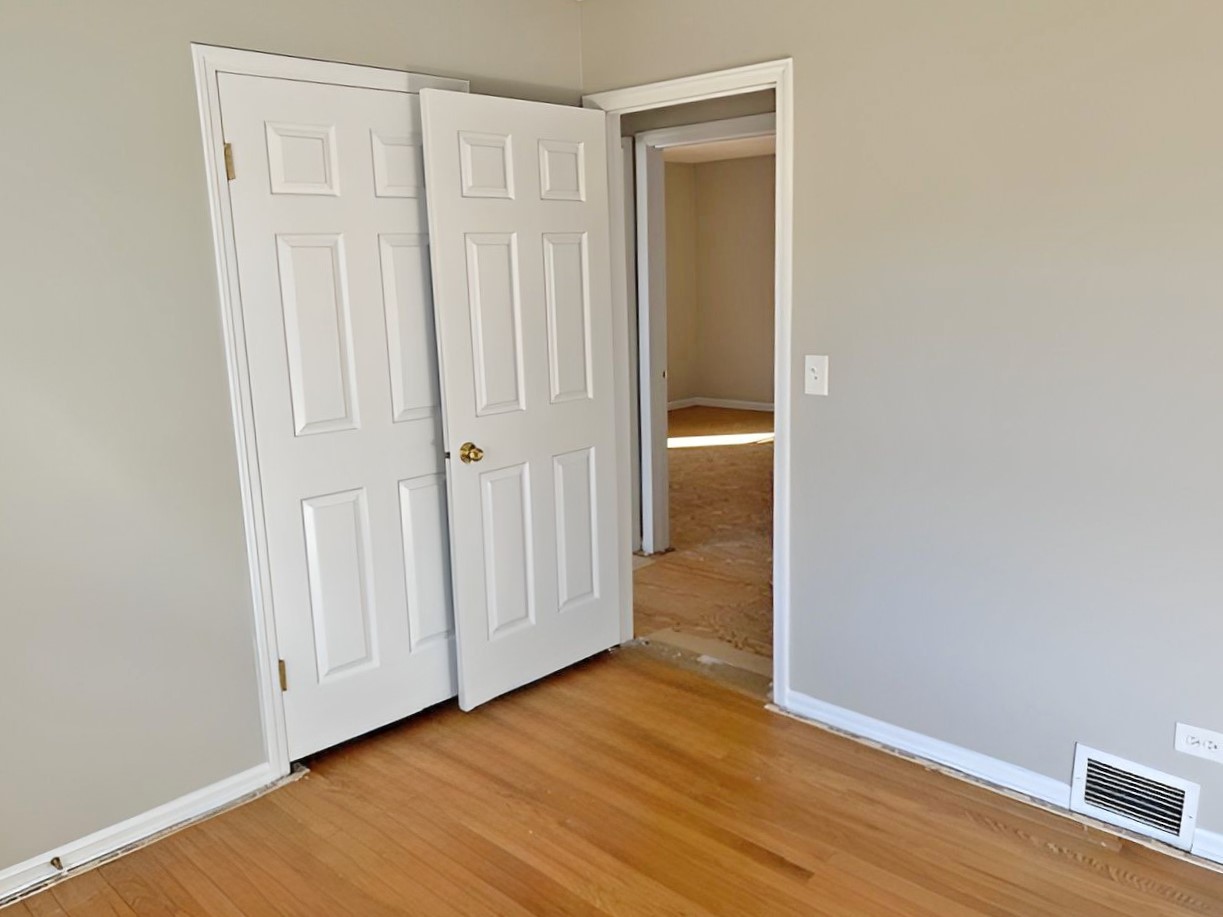 654 Longview Drive Antioch, IL 60002 - Photo 19 of 39 a view of an empty room with wooden floor