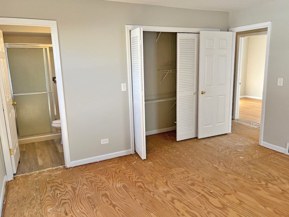 654 Longview Drive Antioch, IL 60002 - Photo 23 of 39 a view of an empty room with closet and wooden floor