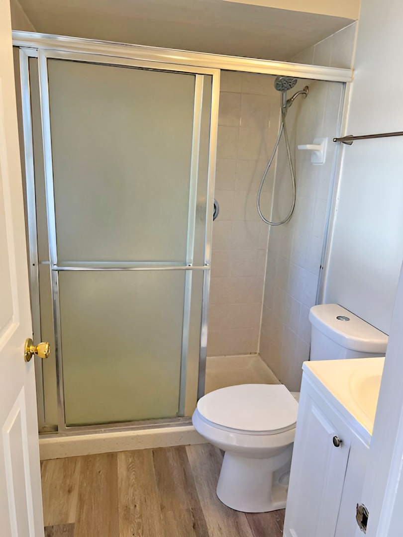 654 Longview Drive Antioch, IL 60002 - Photo 24 of 39 a white toilet sitting next to a shower