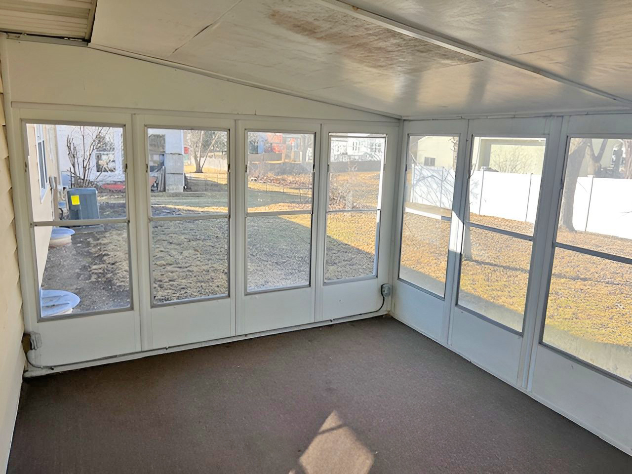 654 Longview Drive Antioch, IL 60002 - Photo 9 of 39 a view of an empty room with wooden floor and a window