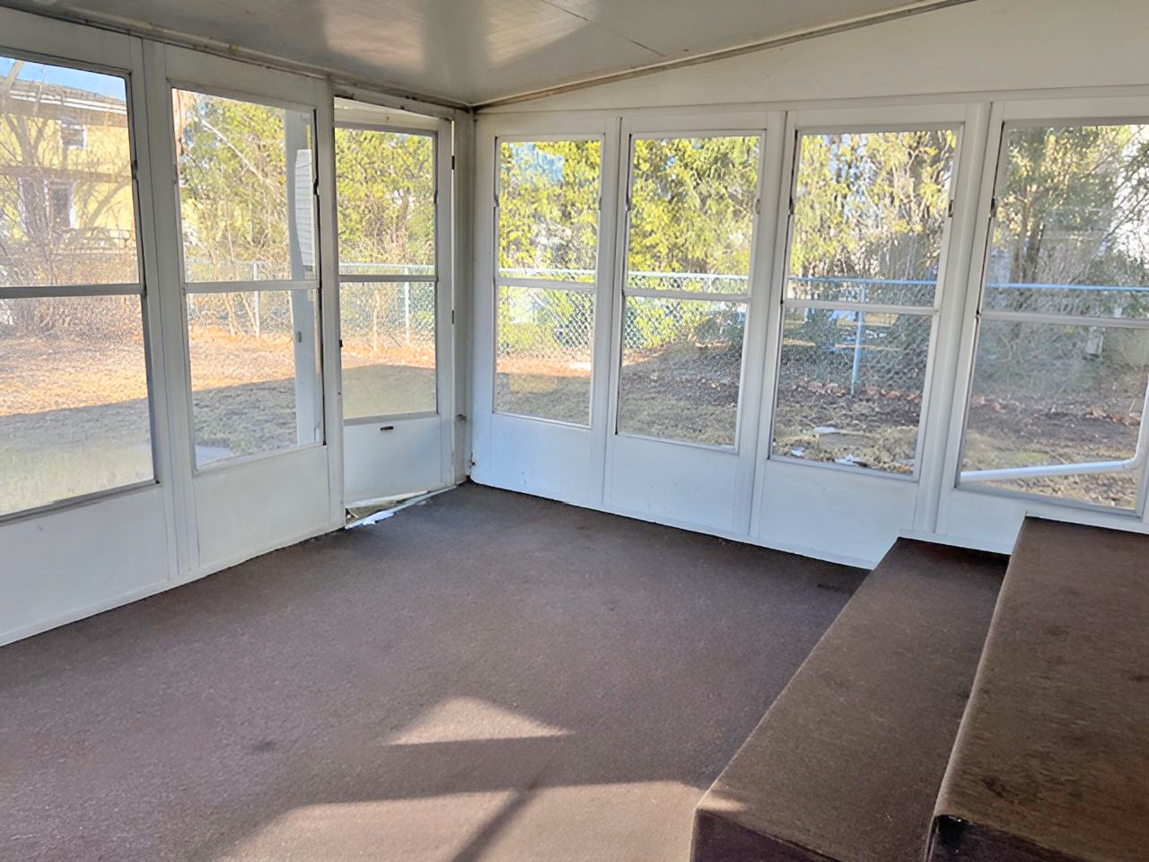 654 Longview Drive Antioch, IL 60002 - Photo 10 of 39 a view of an empty room with wooden floor and door