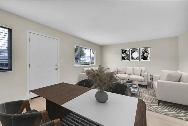 a living room with furniture and a table