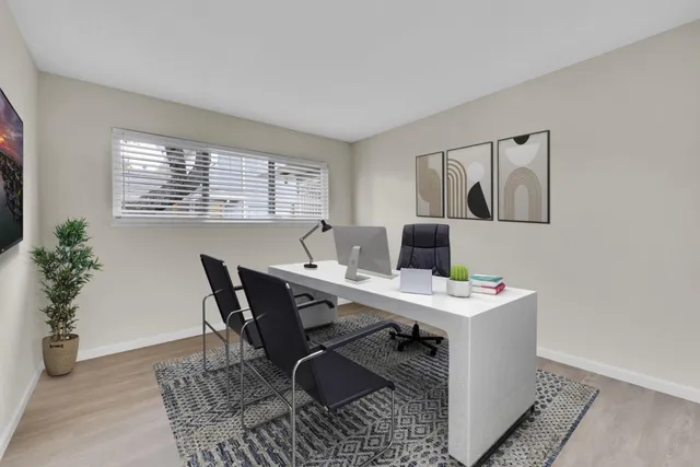 a view of a workspace with furniture